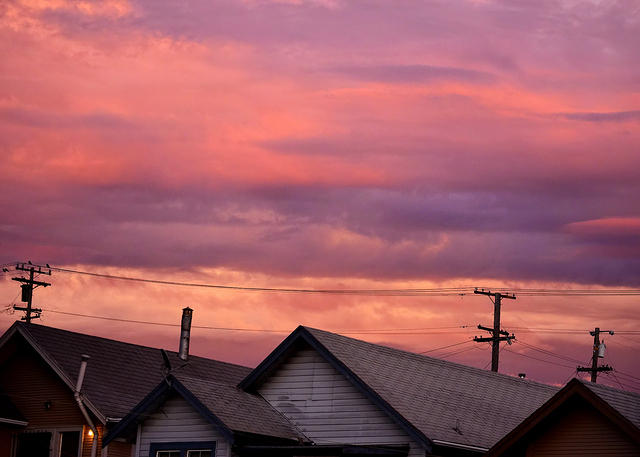 Colorful Clouds atop Roofs